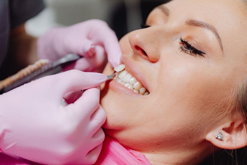 Patient receiving cosmetic dental veneers treatment